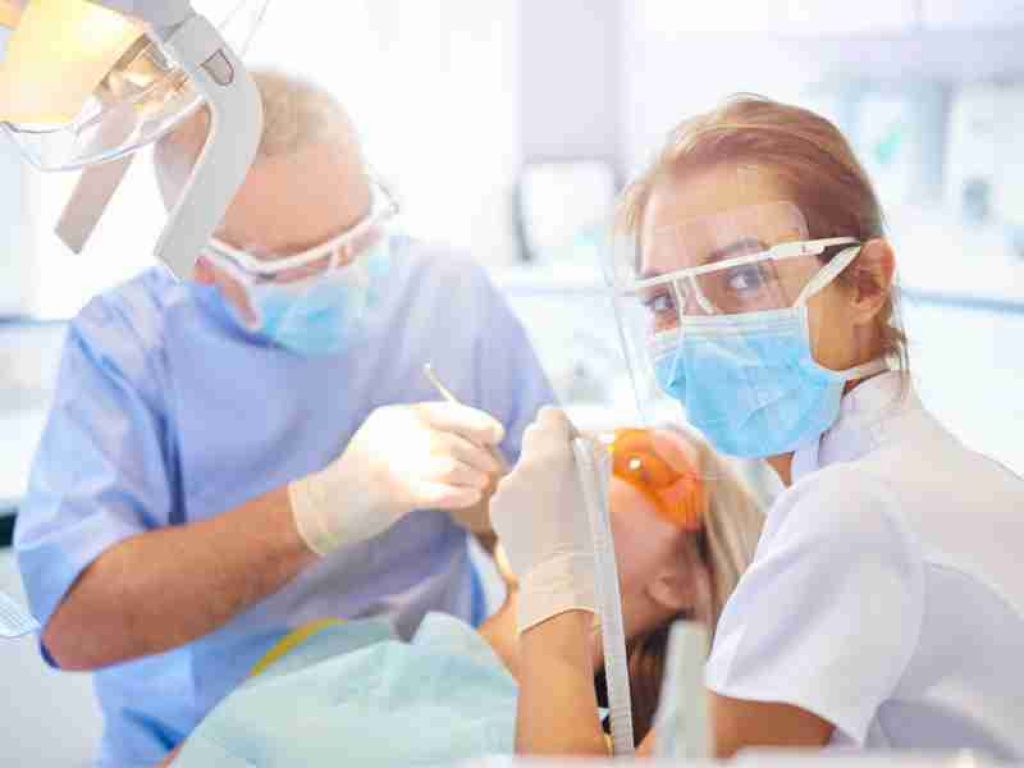 What higher-level positions do dental nurses typically reach?